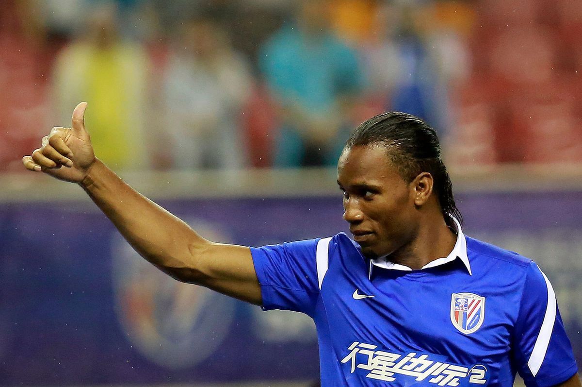 Didier Drogba of Shanghai Shenhua gives a thumbs up to fans, 2012