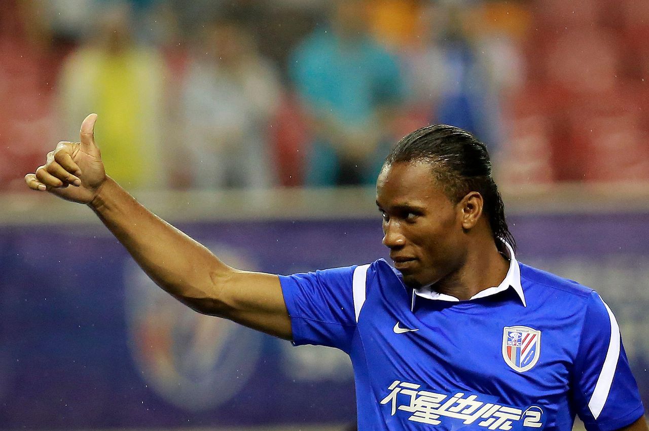 Didier Drogba of Shanghai Shenhua gives a thumbs up to fans, 2012