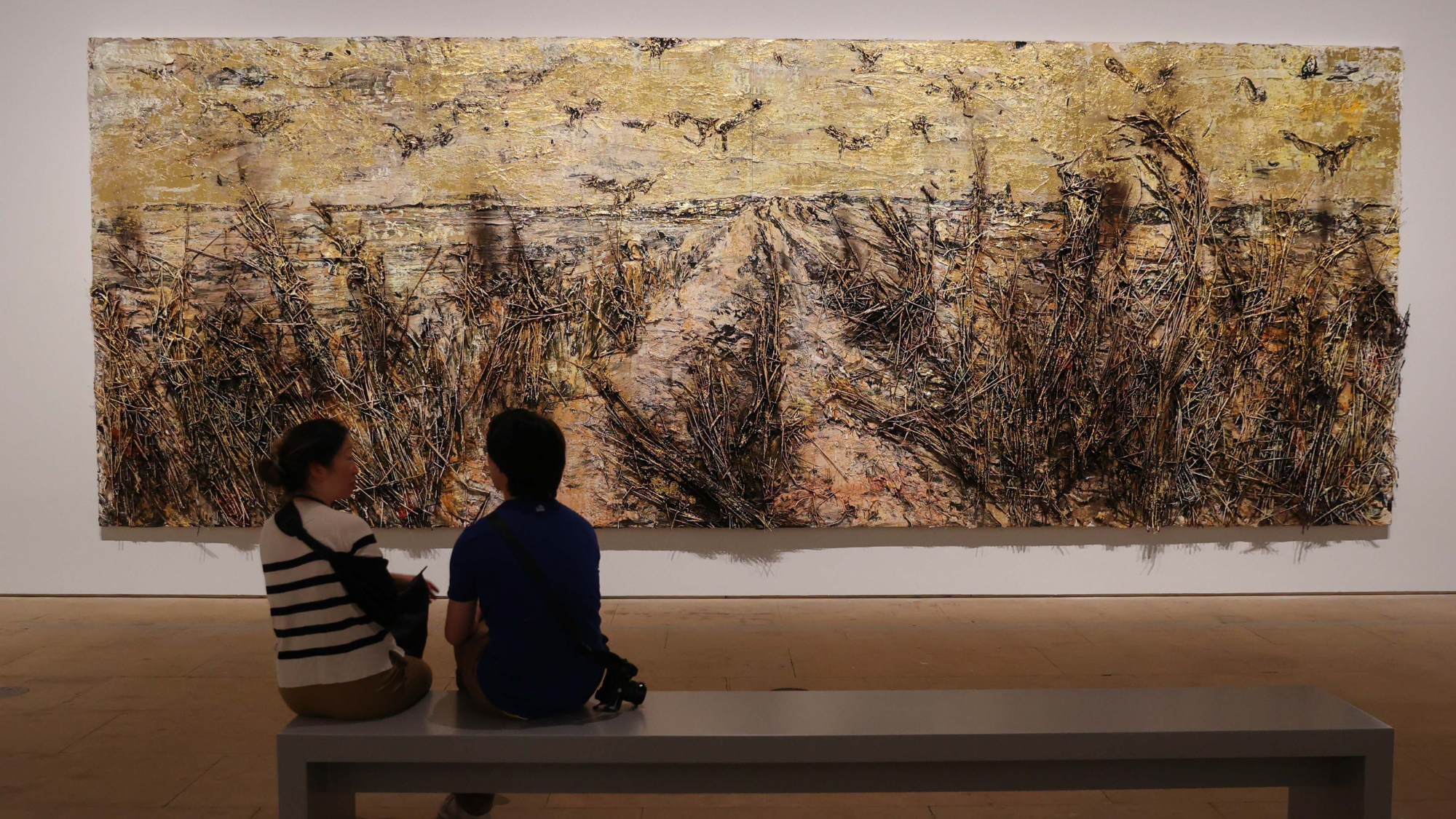 People visit the Kiefer / Van Gogh exhibition and view Kiefer's The Crows (2019): a reinterpretation of Wheatfield with Crows (1890) 