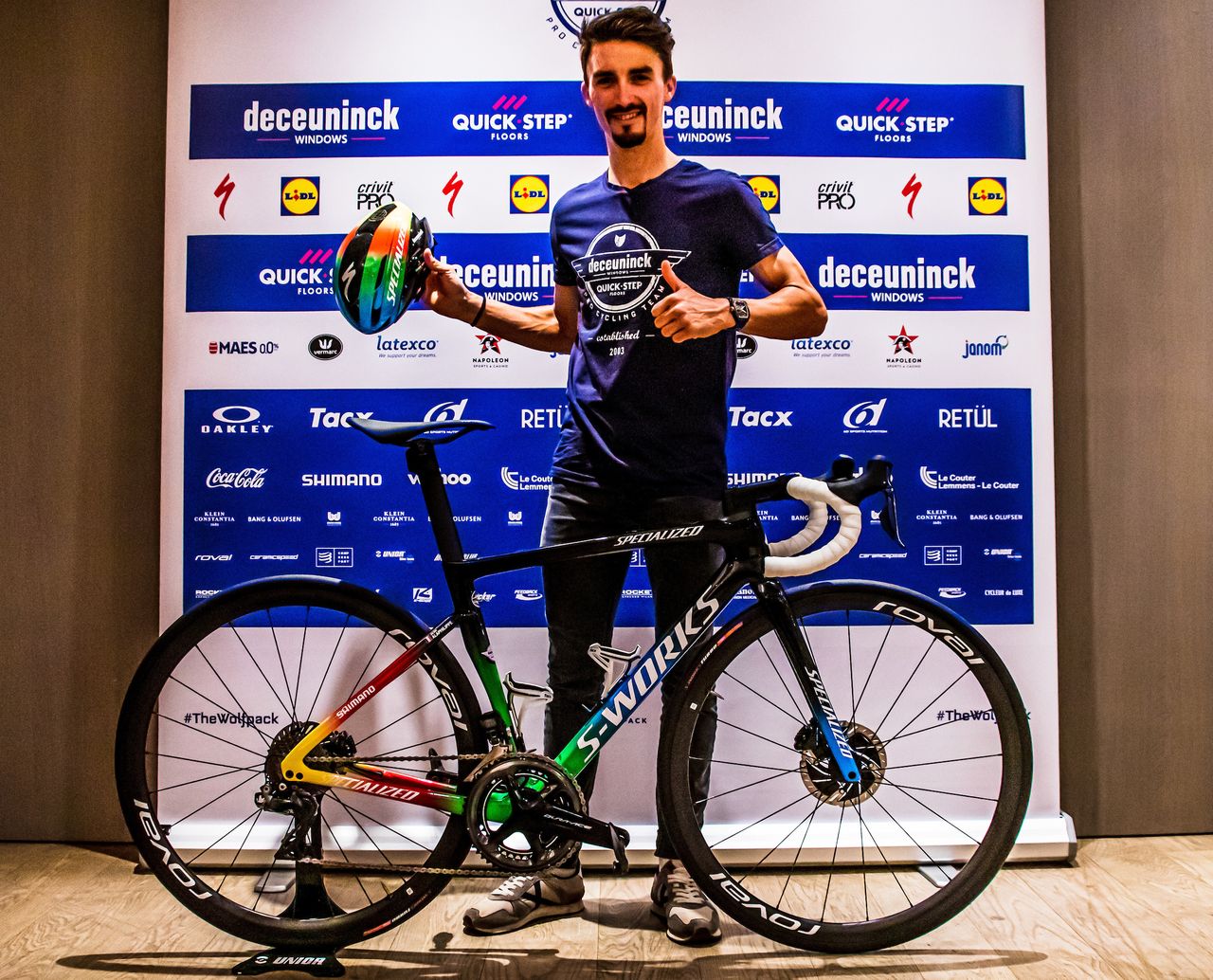 Julian Alaphilippe seems to like his new rainbow-coloured race bike