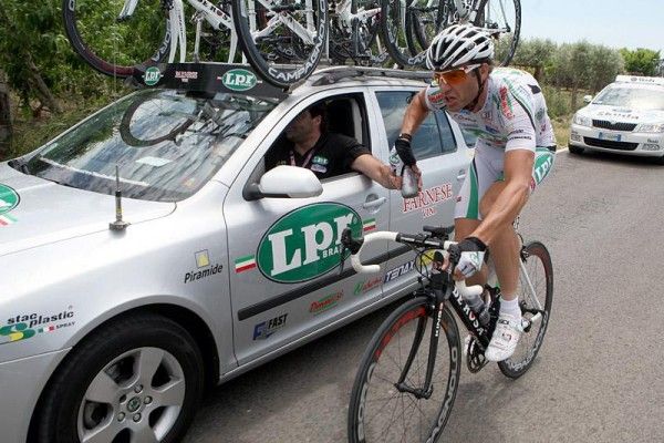 Alessandro Petacchi (LPR Brakes) is back at the team car collecting water bottles for his teammates.