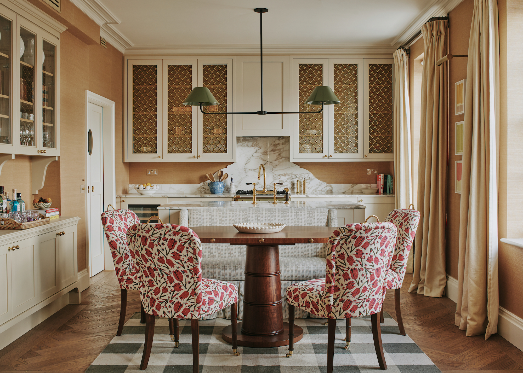 Kitchen with dining table and upholstered chairs and curtains