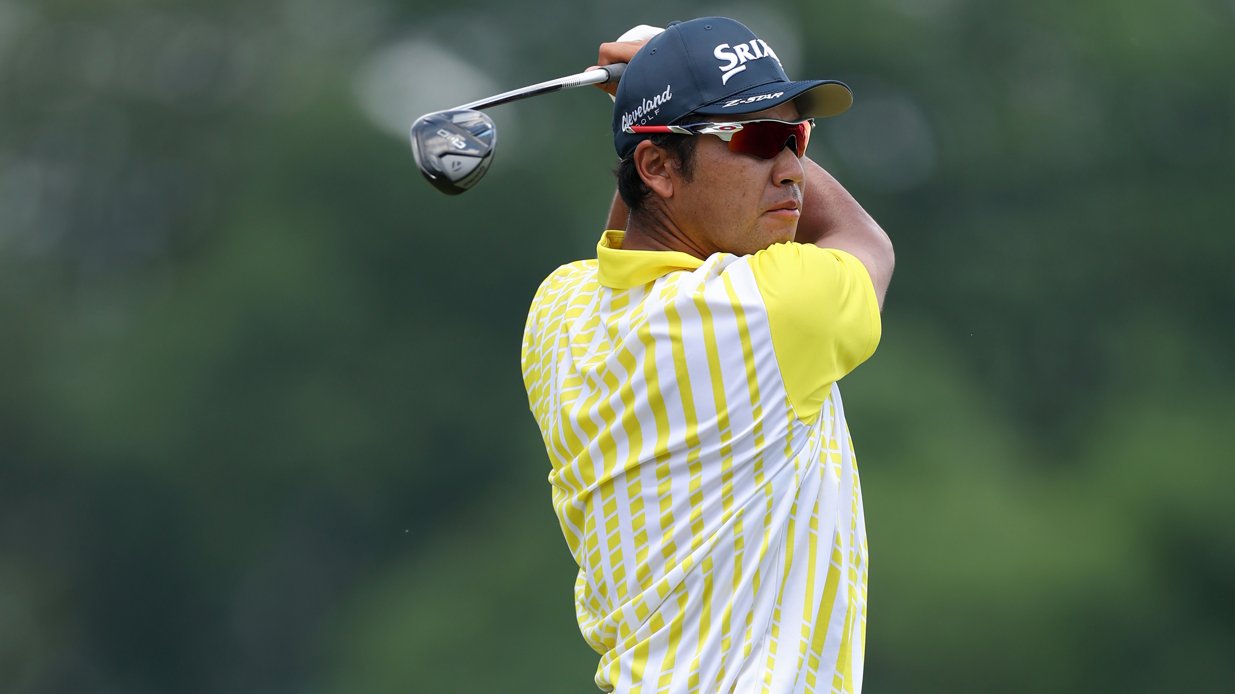 Hideki Matsuyama holds his finish on a fairway wood shot