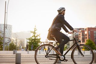 Image shows a person riding a bike with a relaxed geometry for commuting.