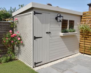 garden shed with trellis on one side