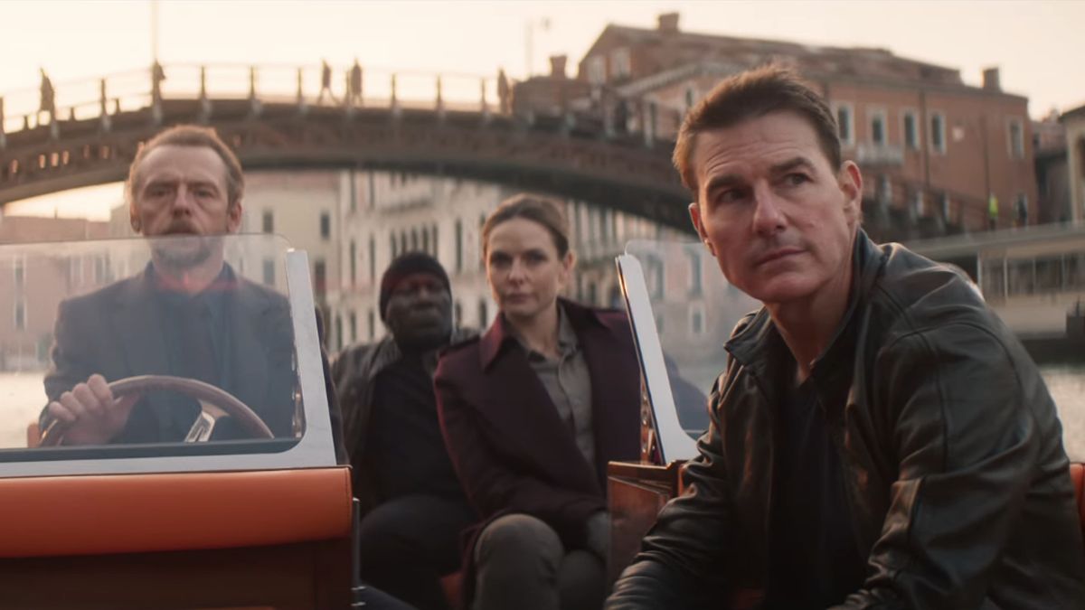 Simon Pegg, Ving Rhames, Rebecca Ferguson, and Tom Cruise sailing on a boat in Mission Impossible Dead Reckoning Part One.