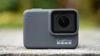 The GoPro Hero 7 Silver sitting on a stone patio