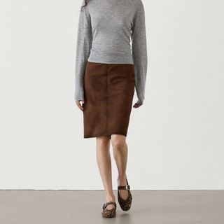 flat lay image of brown suede skirt