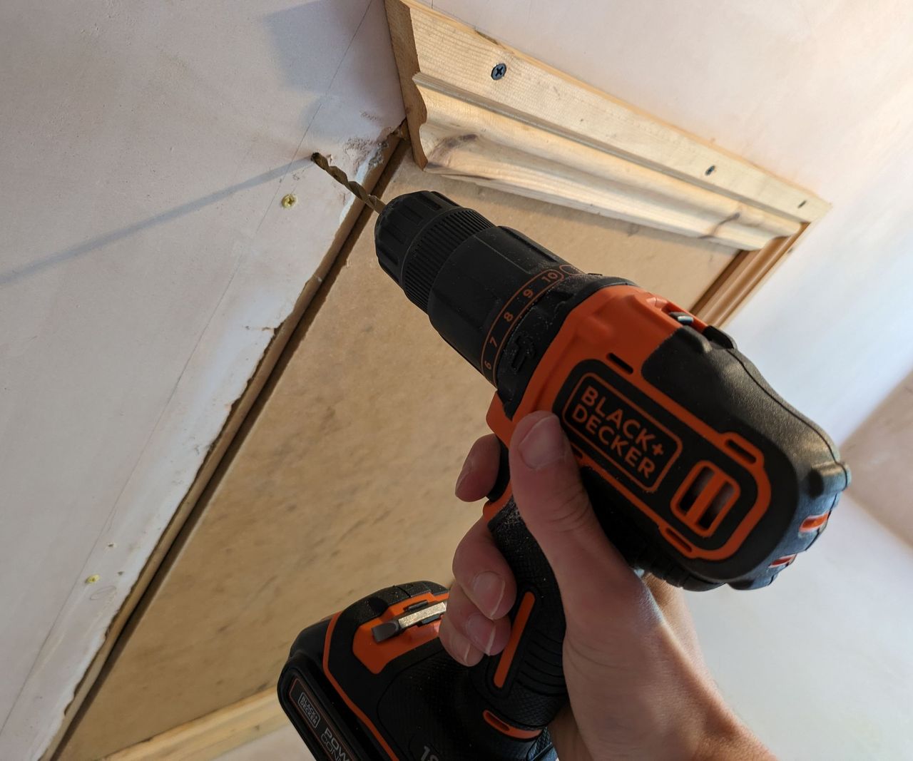 Black &amp; Decker drill drilling into wood