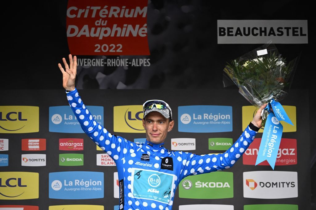 BB HotelsKTM teams French rider Pierre Rolland celebrates on the podium wearing the best climbers jersey at the end of the first stage of the 74th edition of the Criterium du Dauphine cycling race 192 km between La VoultesurRhone and Beauchastel on June 5 2022 Photo by Marco BERTORELLO AFP Photo by MARCO BERTORELLOAFP via Getty Images