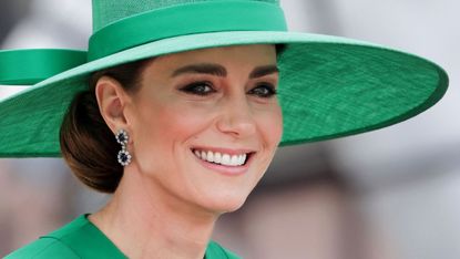 Kate Middleton in green dress and hat and sapphire and diamond earrings at Trooping the Colour