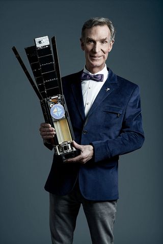 Bill Nye, chief executive of The Planetary Society holds a LightSail spacecraft. Nye will host a preview of FUTURES, which includes two new models of the solar sail satellite.