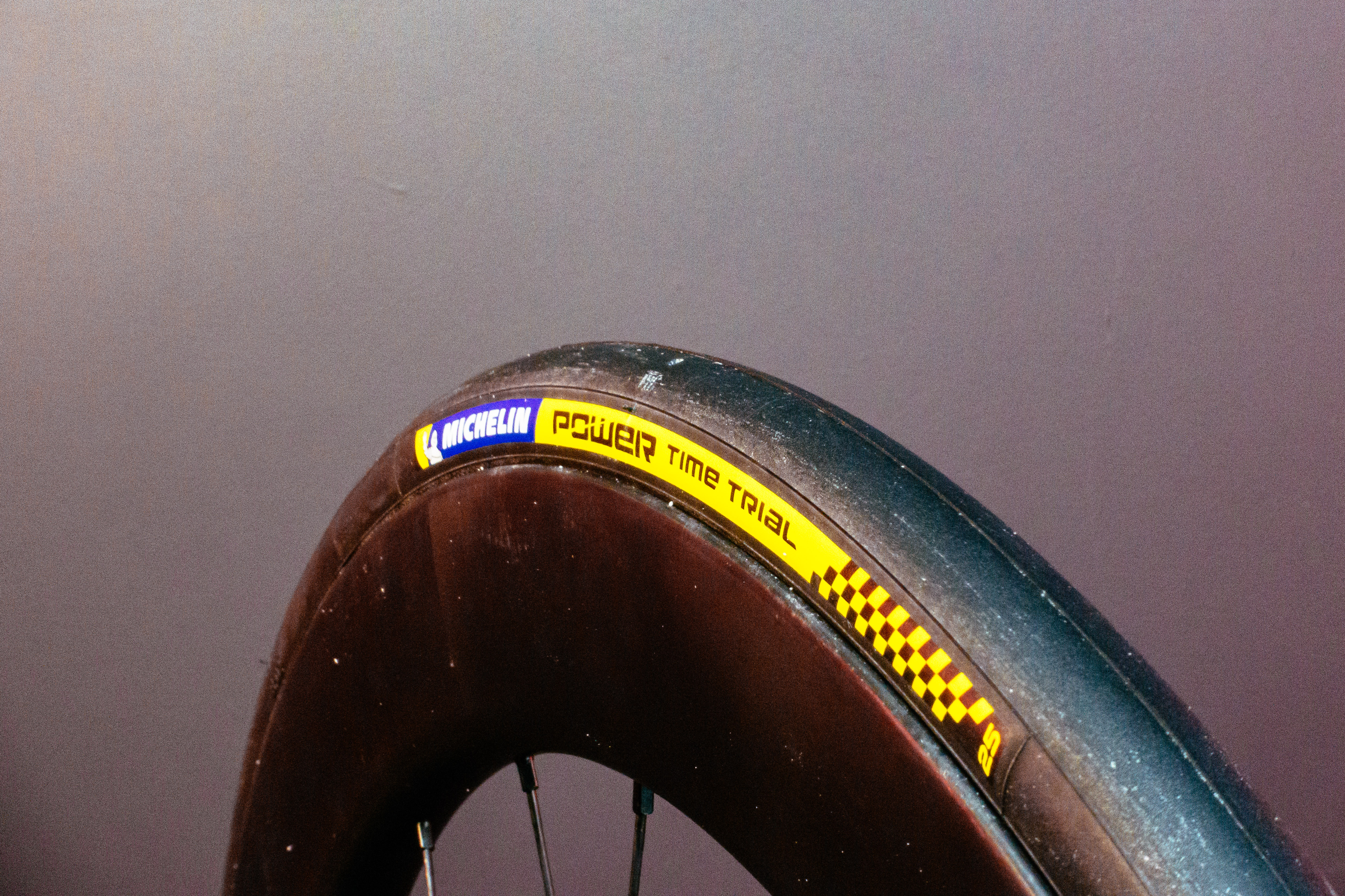 Michelin Power Time Trial Road tyre with a red background