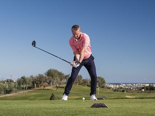 Anders Mankert demonstrating the correct position for the trail elbow in the downswing