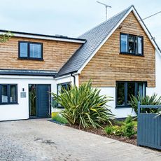 Renovated bungalow with pitched roof and wood cladding