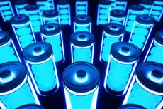 Transparent and blue lithium battery with four cells on a black background