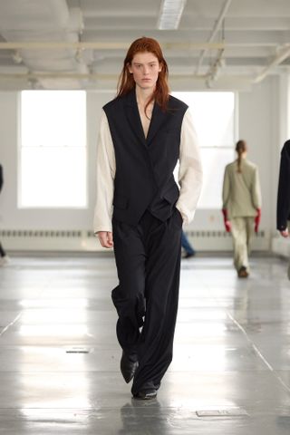 Tibi Fall 2025 model in a striped suit