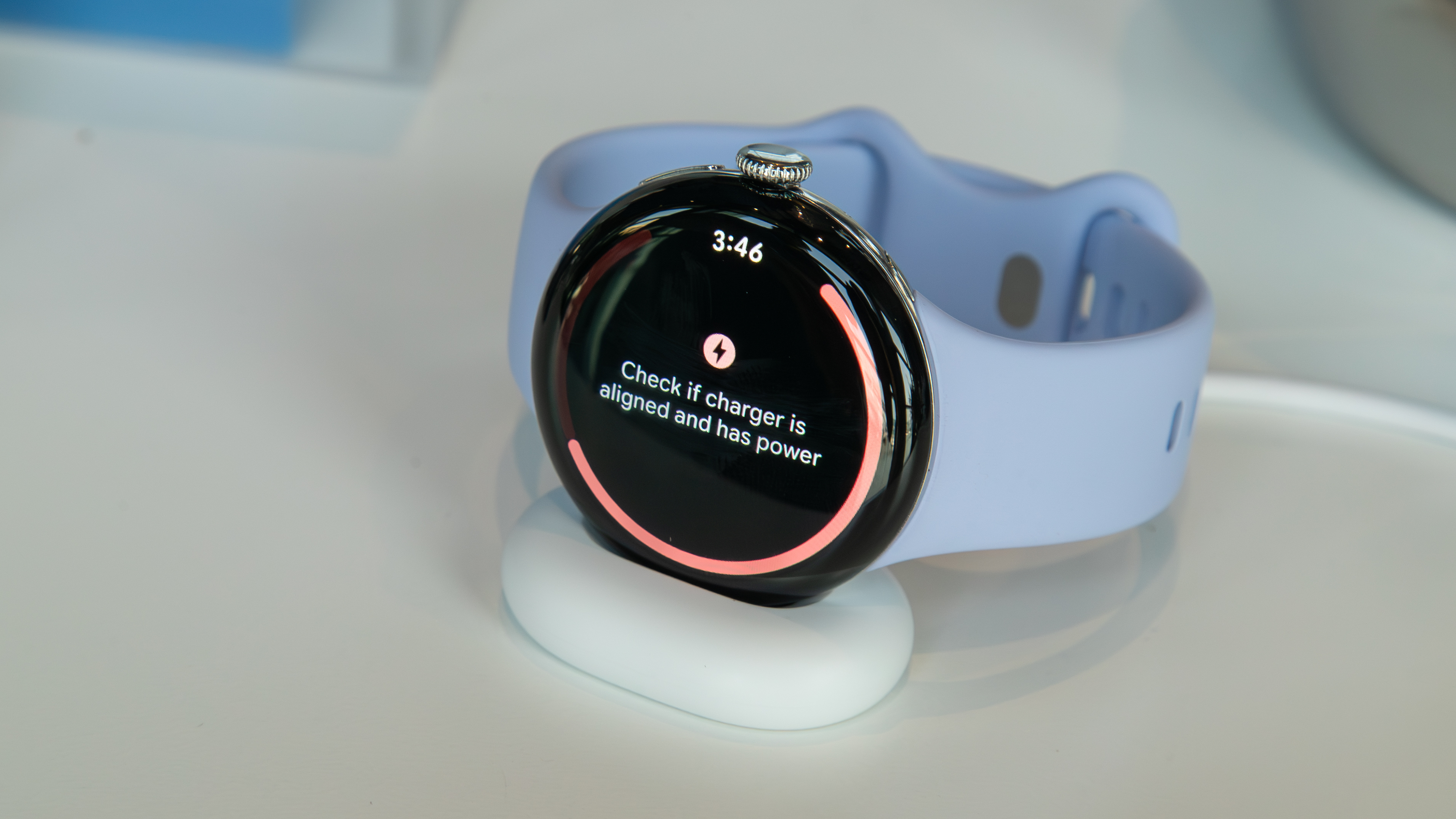 Pixel Watch 4 on a charger indicating that the alignment is off