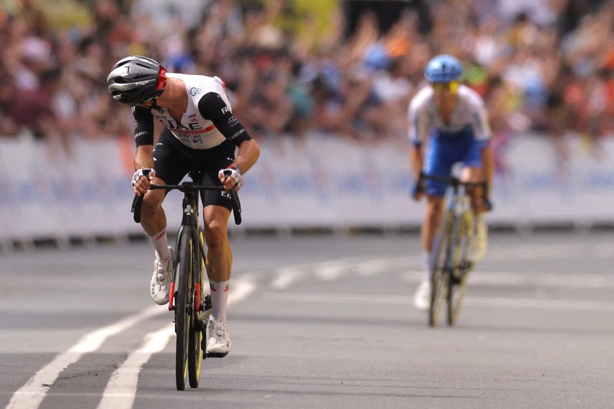 UAE Team Emirates British rider Adam Yates L looks back as he cycles to the finish line to win ahead of his brother Team Jayco Alulas British rider Simon Yates placing second during the 1st stage of the 110th edition of the Tour de France cycling race 182 km departing and finishing in Bilbao in northern Spain on July 1 2023 Photo by Thomas SAMSON AFP Photo by THOMAS SAMSONAFP via Getty Images