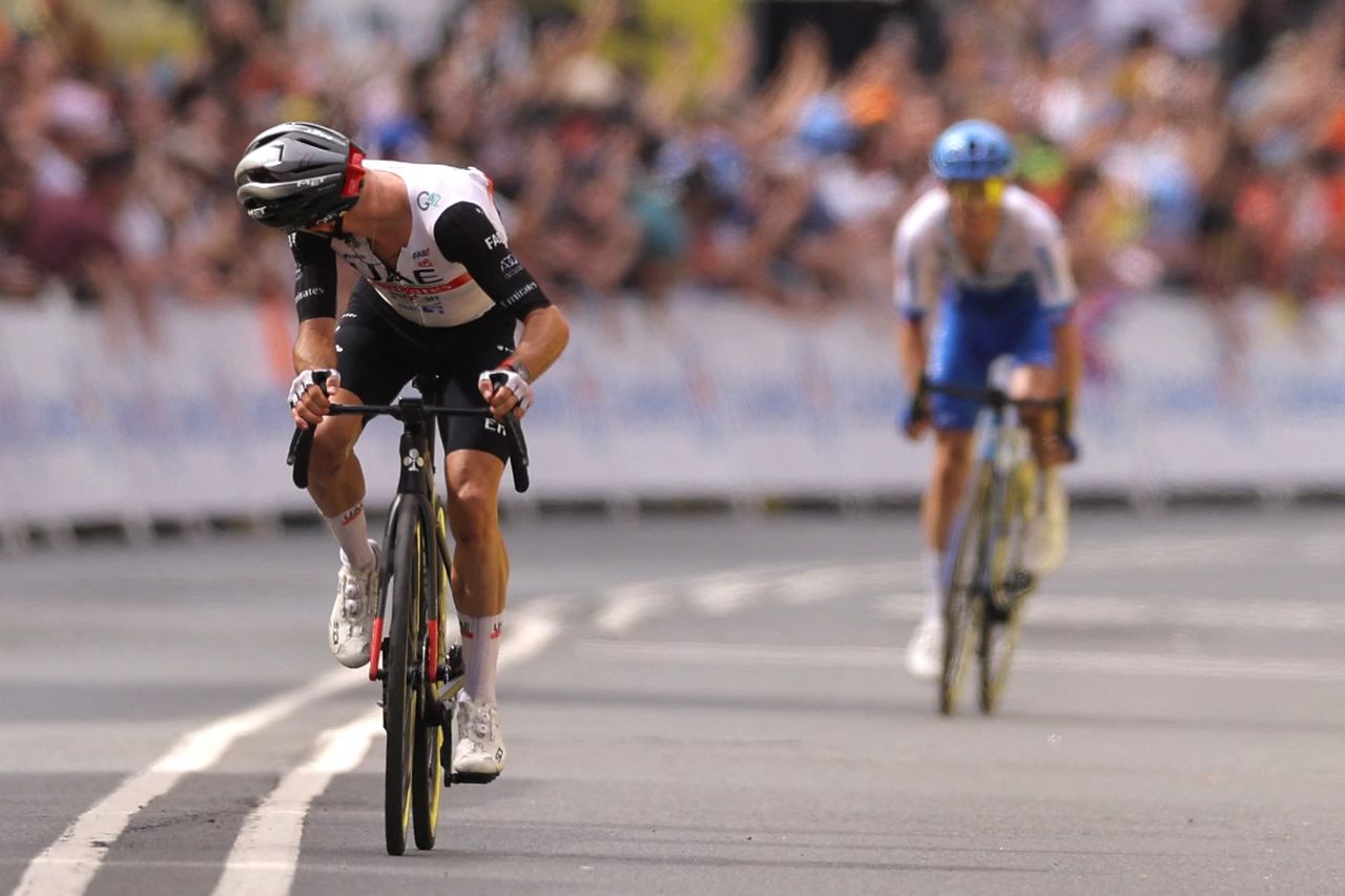 UAE Team Emirates British rider Adam Yates L looks back as he cycles to the finish line to win ahead of his brother Team Jayco Alulas British rider Simon Yates placing second during the 1st stage of the 110th edition of the Tour de France cycling race 182 km departing and finishing in Bilbao in northern Spain on July 1 2023 Photo by Thomas SAMSON AFP Photo by THOMAS SAMSONAFP via Getty Images