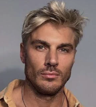 a white man with blonde hair and a short beard