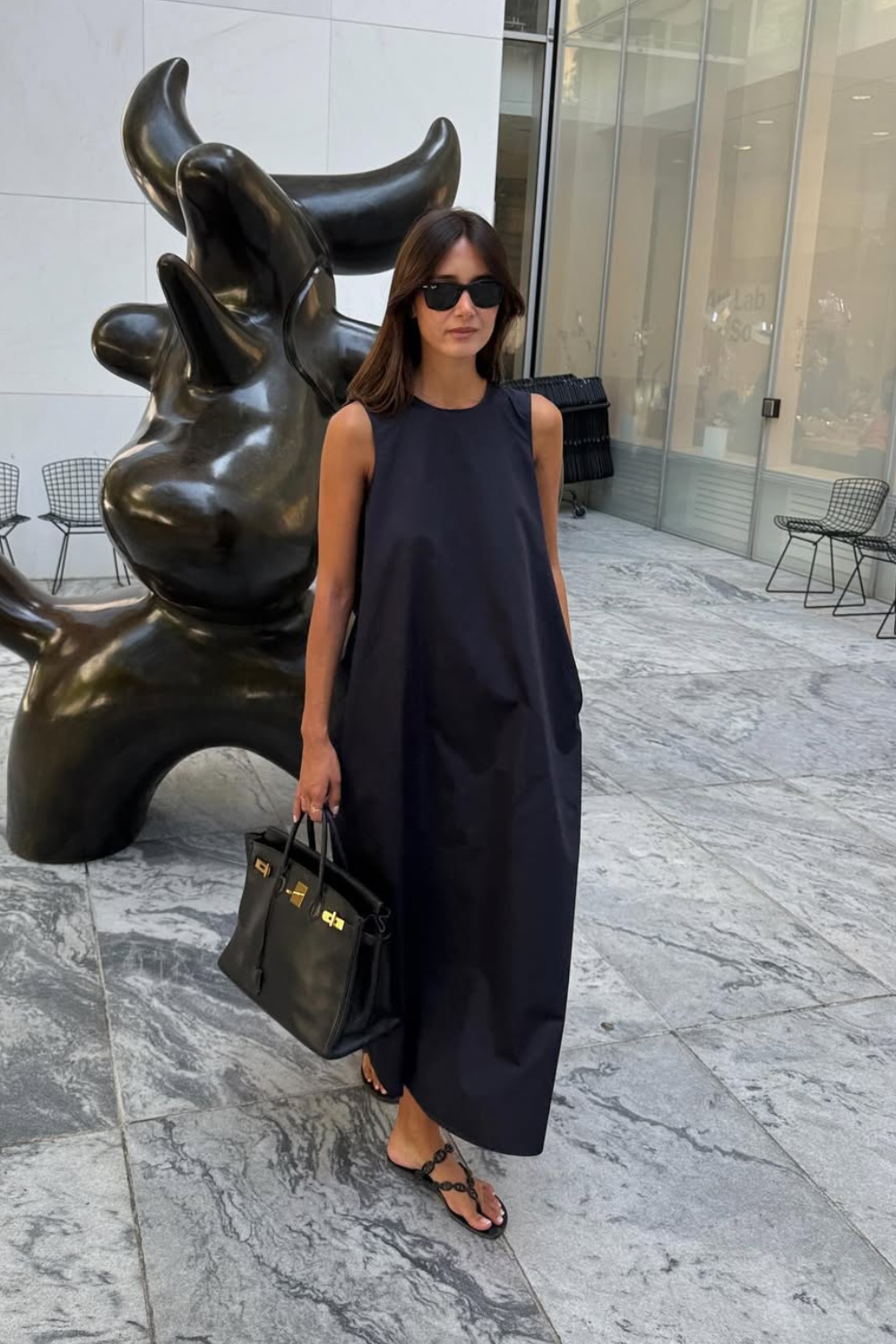 @lisonseb wears navy maxi dress, black sandals, black bag, sunglasses