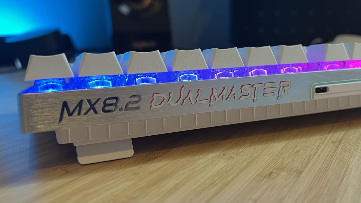 Close up on 'DualMaster' iconography along top lip of Cherry XTRFY MX 8.2 Pro TMR Wireless gaming keyboard