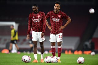 Arsenal’s Pierre-Emerick Aubameyang (right) and Ainsley Maitland-Niles warm up before the Premier League match at the Emirates Stadium, London