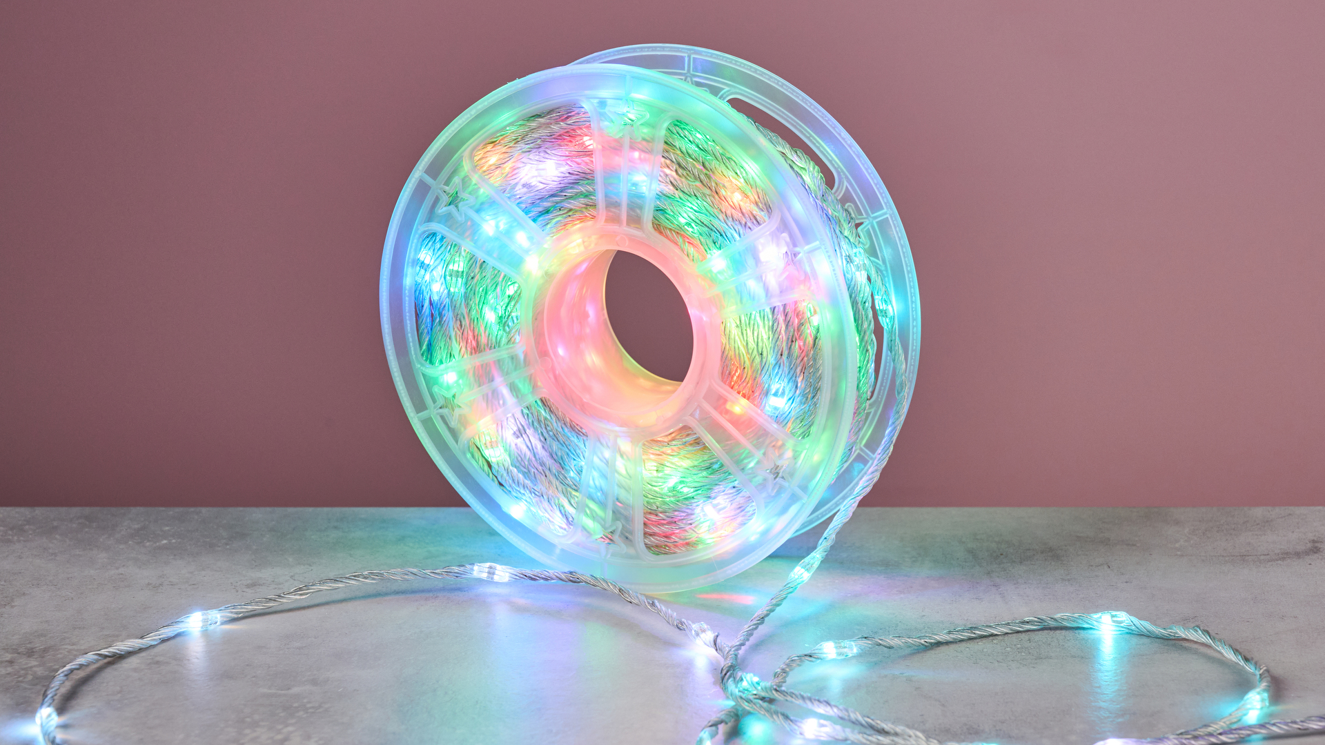 The Govee Christmas String Lights 2 are pictured lit up in multiple colors on the reel.