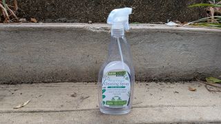 White vinegar spray bottle on concrete step