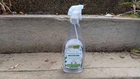 White vinegar spray bottle on concrete step