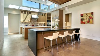 A modern kitchen with a waterfall countertop