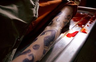 titans the riddler's arm tattooed with question marks