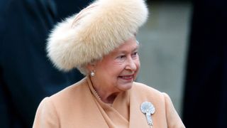 Queen Elizabeth attends the unveiling of a new statue of the Queen Mother