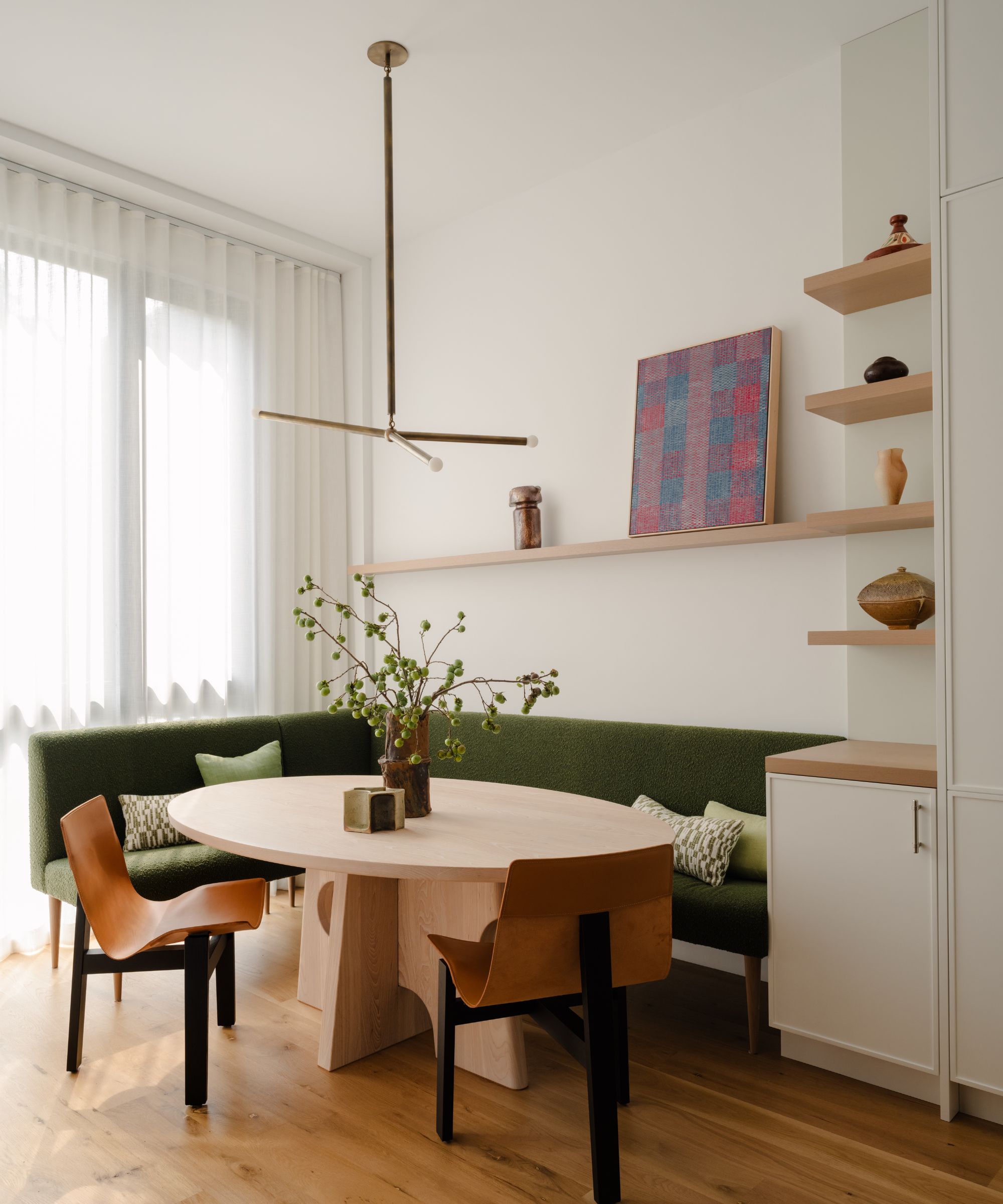 dining nook with green banquette