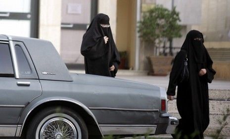 Two Saudi women walk past a parked car: A female Saudi activist, Manal al-Sharif, defied the conservative Muslim kingdom&amp;#039;s ban on women driving and spent five days in jail as a result.