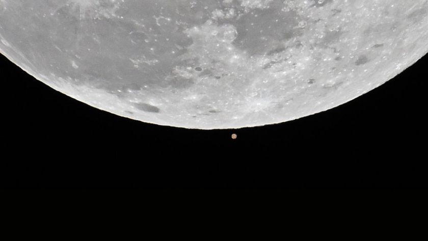 The first full moon of the 2025 called 'Wolf Moon' that seen next to Mars rises over the sky during a lunar occultation of Mars in Charlotte, United States on January 13, 2025. 