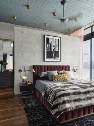 concrete bedroom with a room divider