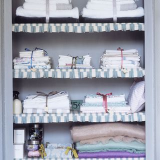 cupboard with laundry storage and napkins with cloths