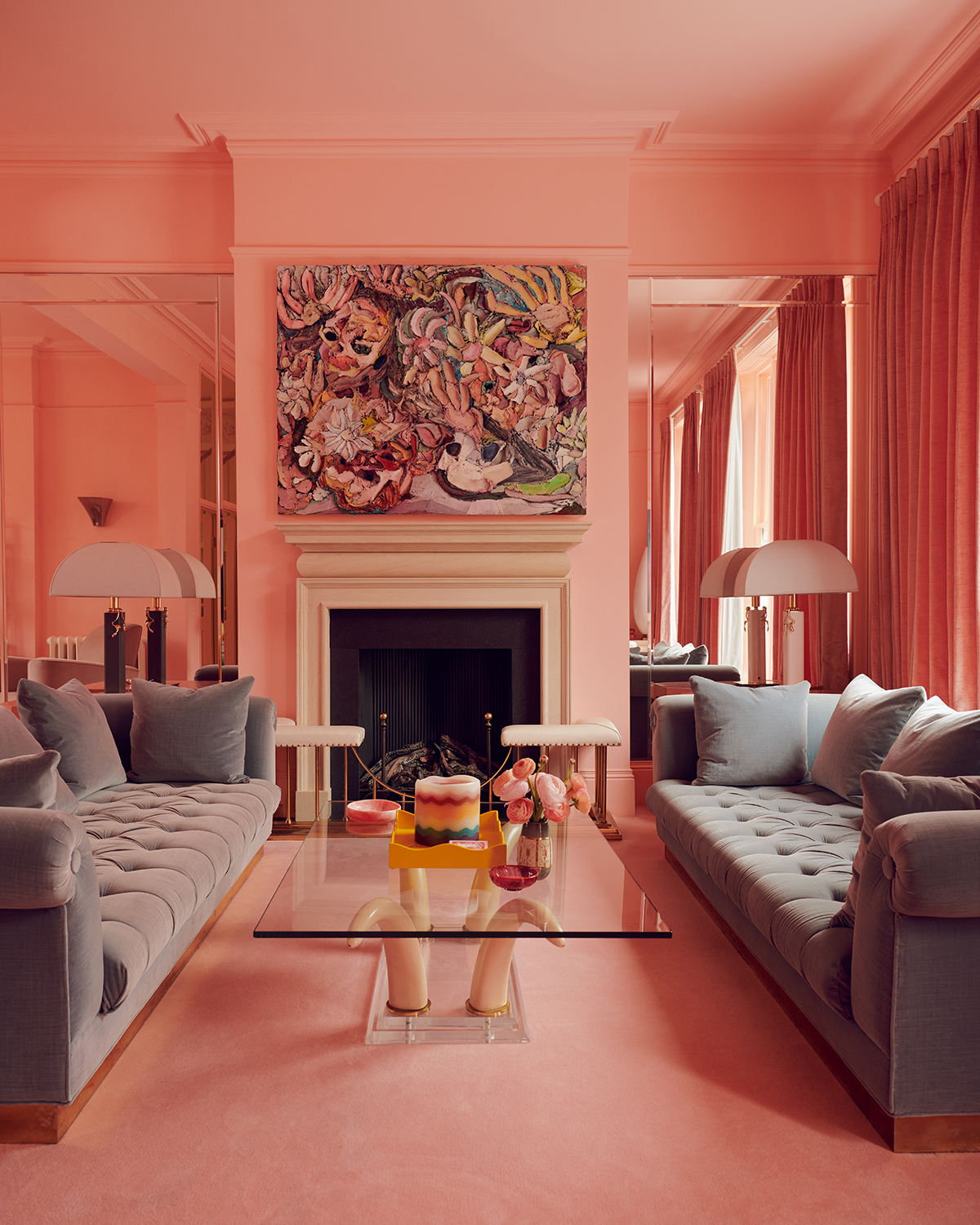 pink living room with gray sofas