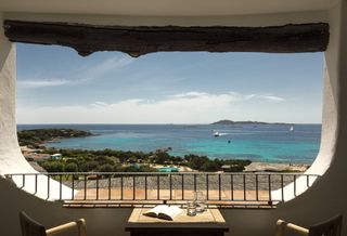 The view of the turquoise water from a terrace at Romazzino hotel on Sardinia