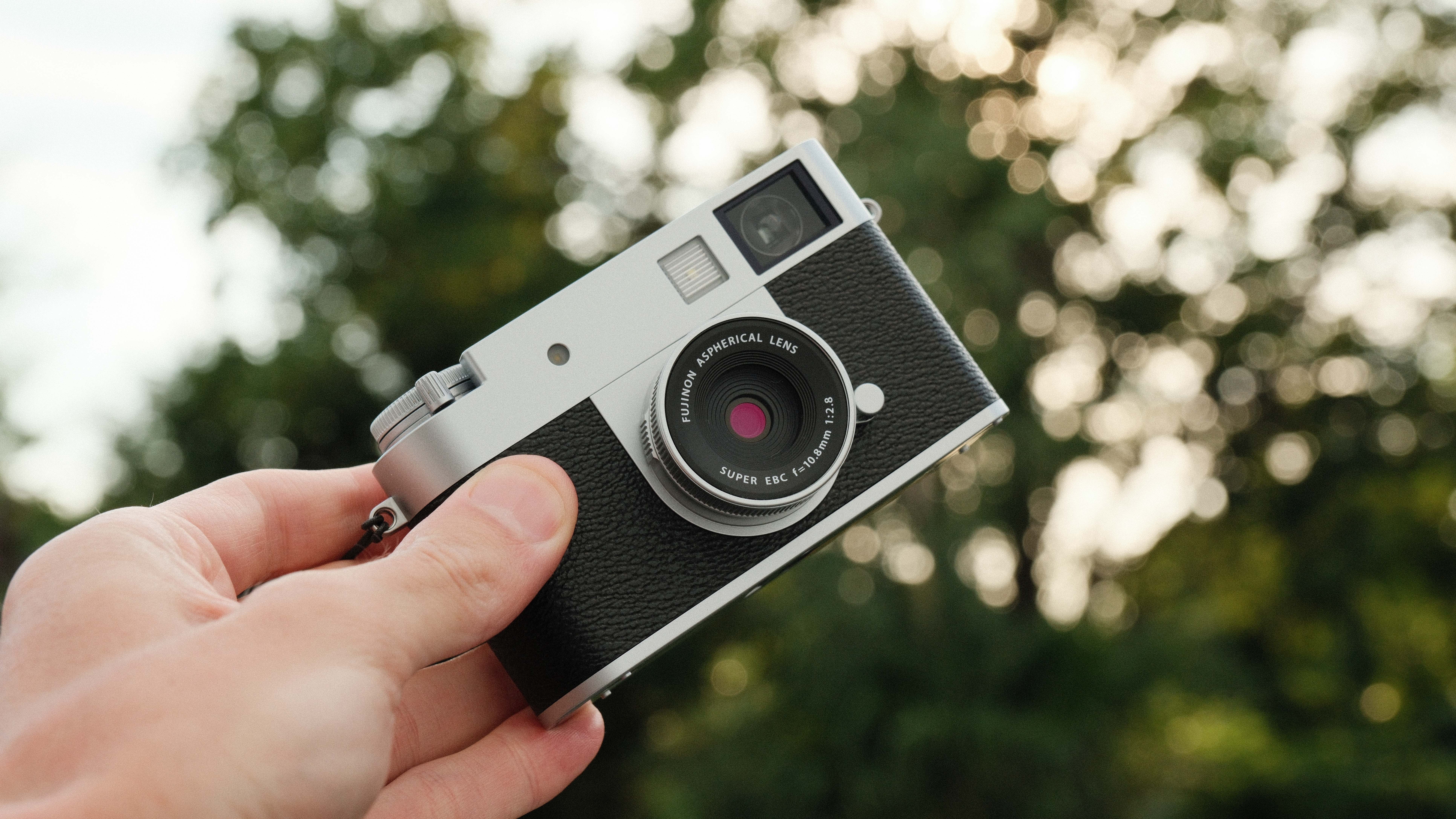 Fujifilm X Half camera held in a hand