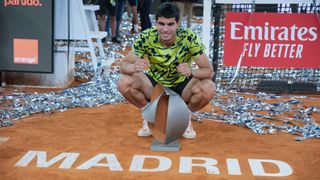 Carlos Alcaraz on court with the Madrid Open trophy