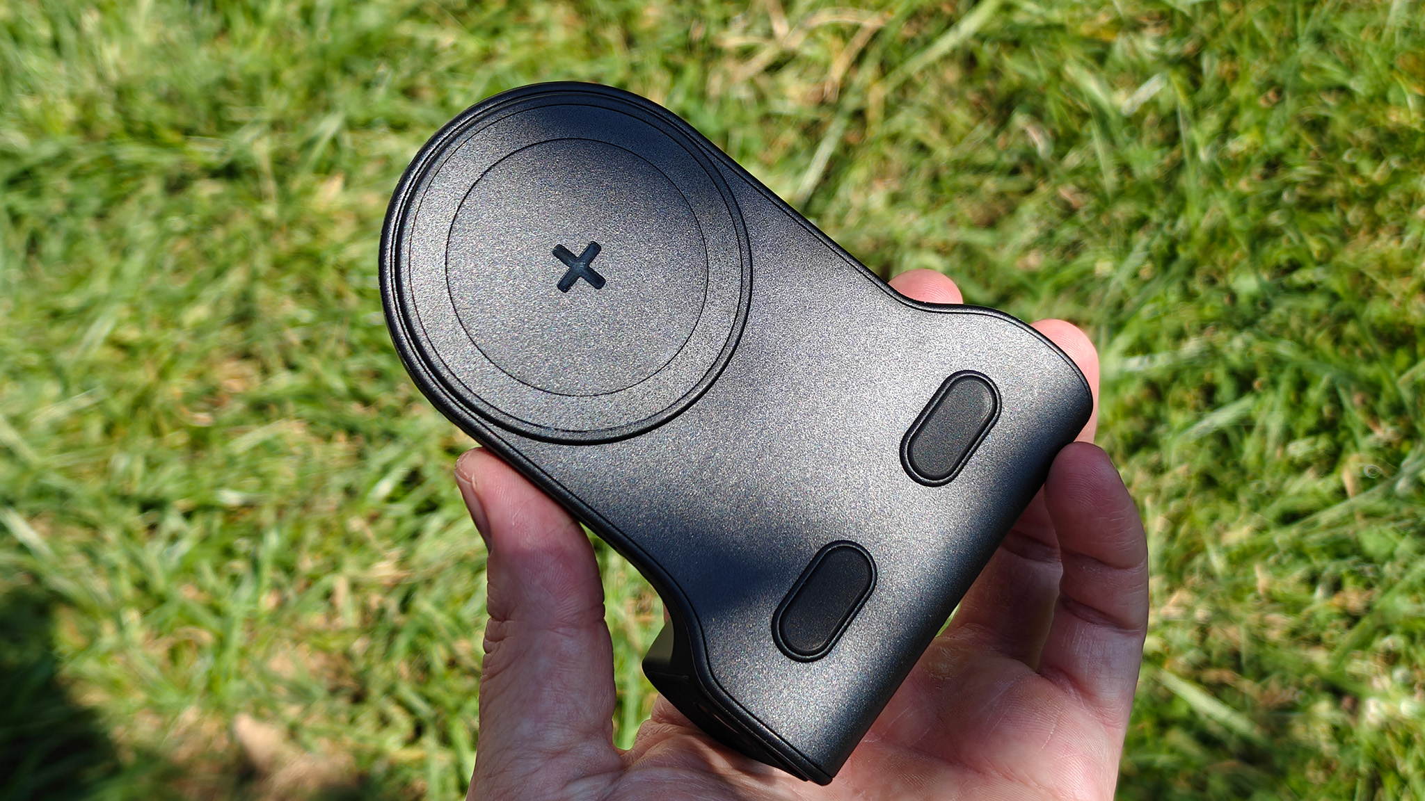 The back of a KraftGeek magnetic camera grip with its rubber pads and magnetic connector