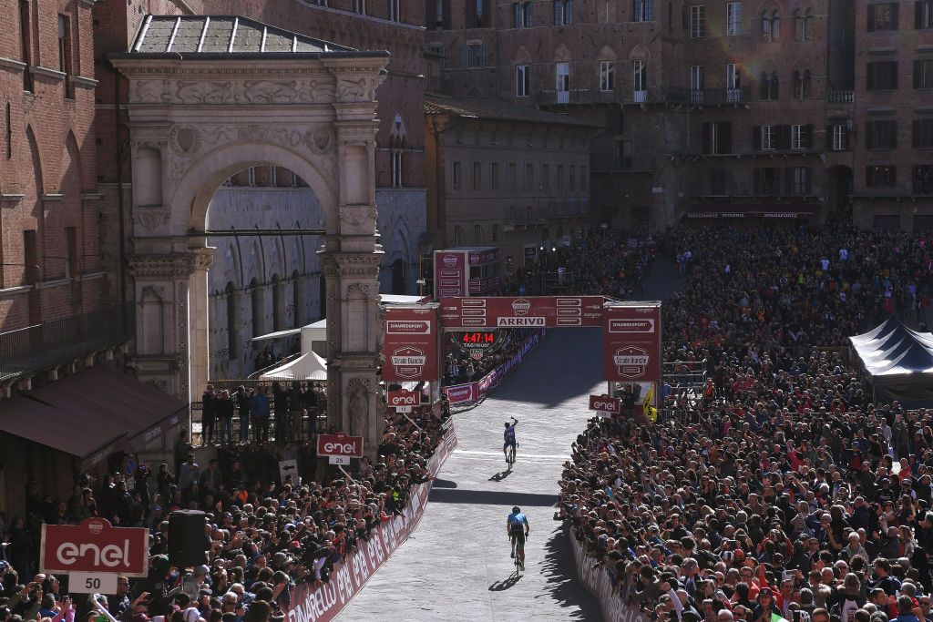 SIENA ITALY MARCH 09 Arrival Julian Alaphilippe of France and Team Deceuninck QuickStep Celebration Jakob Fuglsang of Denmark and Astana Pro Team during the Eroica 13th Strade Bianche 2019 a 184km race from Siena to SienaPiazza del Campo Piazza del Campo Fans Public Landscape StradeBianche on March 09 2019 in Siena Italy Photo by Luc ClaessenGetty Images