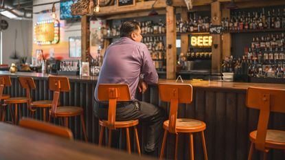 Man drinking at a bar
