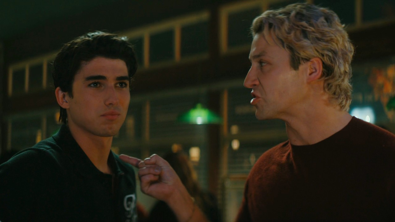 From left to right: Hunter Davenport and Dean angerly pointing at him in Off Campus.