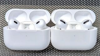 AirPods Pro and AirPods Pro 2 in charging case and placed side by side for face-off test