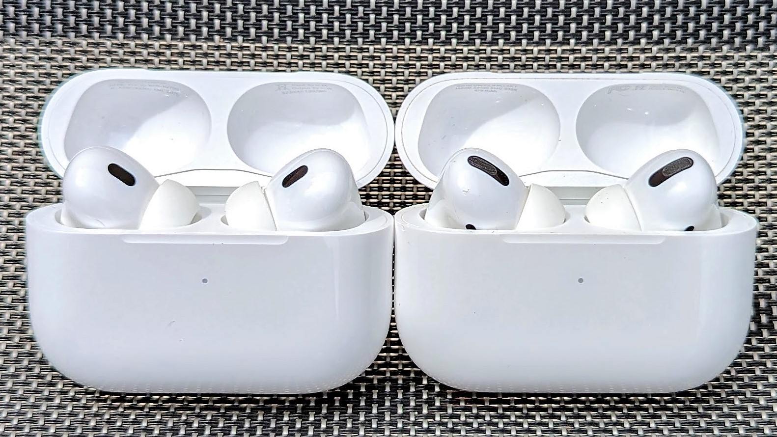 AirPods Pro and AirPods Pro 2 in the charging case and placed side by side for face-testing