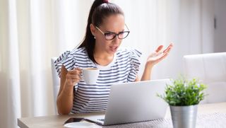 woman annoyed at laptop